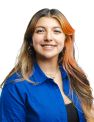 Brunette woman with red dyed hair streaks wearing a blue shirt