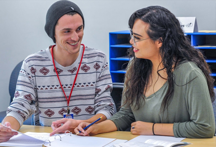 Man tutoring a woman