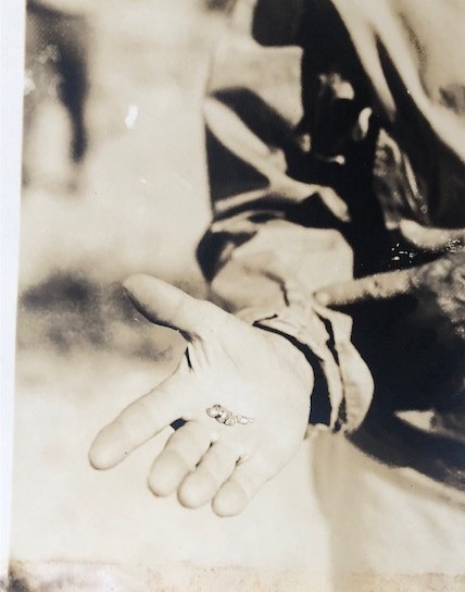 close-up of marine specimen in Captain Hancock's hand from photo above