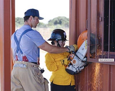 Firefighter using chainsaw